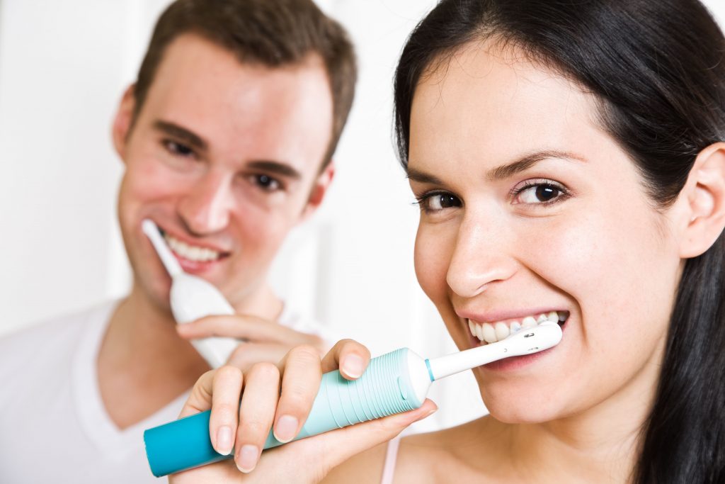 Couple Brushing their teeth